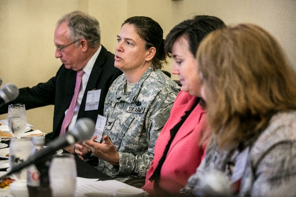 Col. Claire Cuccio, USA, Office of the Secretary of Defense for Acquisition, Technology and Logistics, addresses attendees at the August Women in NOVA event.